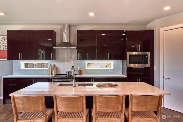17726 142nd Ave E Unit 9, Puyallup, WA 98374 - kitchen featuring wall chimney range hood, stainless steel microwave, a sink, light countertops, and modern cabinets