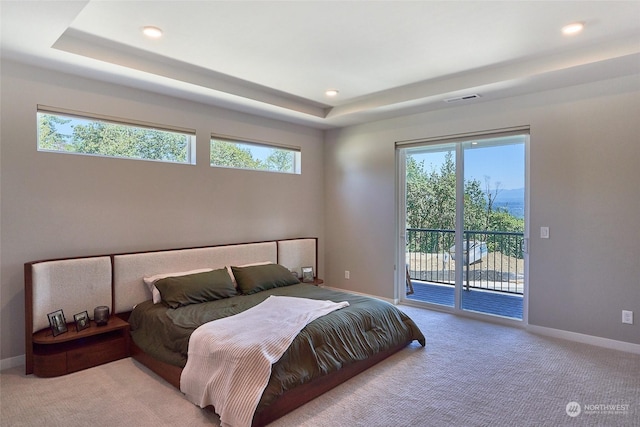17726 142nd Ave E Unit 9, Puyallup, WA 98374 - carpeted bedroom featuring access to outside, a tray ceiling, multiple windows, recessed lighting, and baseboards