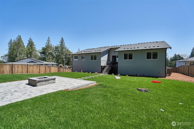17726 142nd Ave E Unit 9, Puyallup, WA 98374 - back of house with a patio area, an outdoor fire pit, and cooling unit