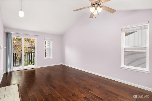 empty room featuring hardwood / wood-style flooring, ceiling fan, and high vaulted ceiling