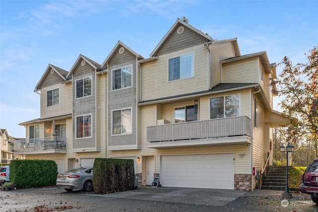 view of property with driveway and an attached garage