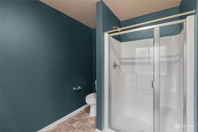 394 Lake View Loop NE, Ocean Shores, WA 98569 - bathroom with a shower stall, toilet, and baseboards