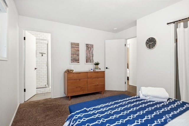 carpeted bedroom featuring ensuite bathroom