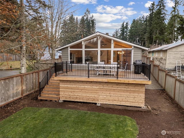 back of house featuring a deck