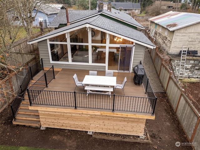 wooden terrace with a grill