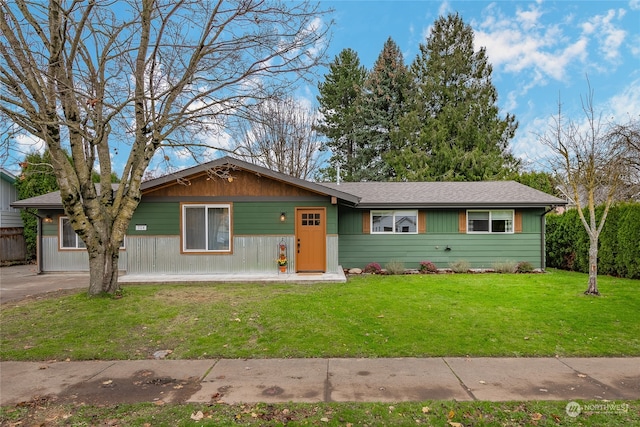 single story home featuring a front yard