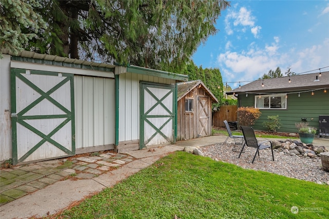 view of outbuilding with a lawn