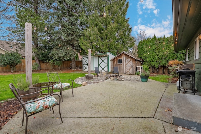 view of patio / terrace featuring a storage shed and grilling area