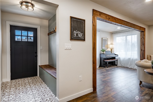 foyer with wood-type flooring