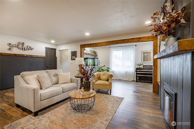 living room with dark hardwood / wood-style flooring