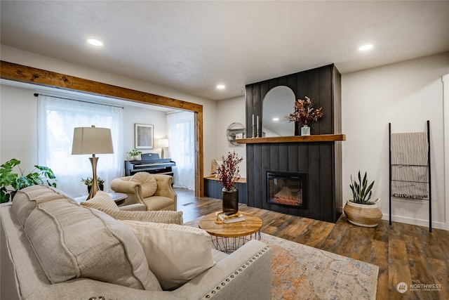 living room featuring dark hardwood / wood-style floors and a fireplace