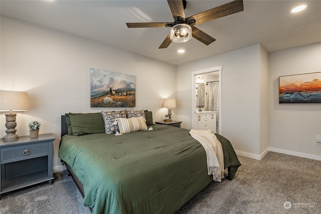 carpeted bedroom with connected bathroom and ceiling fan