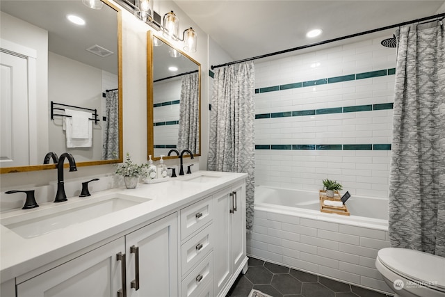 full bathroom with toilet, vanity, tile patterned floors, and shower / bathtub combination with curtain