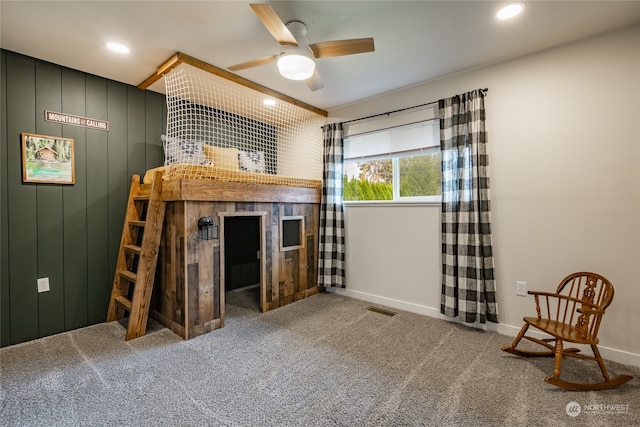 unfurnished bedroom with ceiling fan and carpet floors