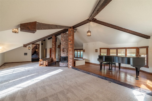 unfurnished living room with wood-type flooring and vaulted ceiling with beams