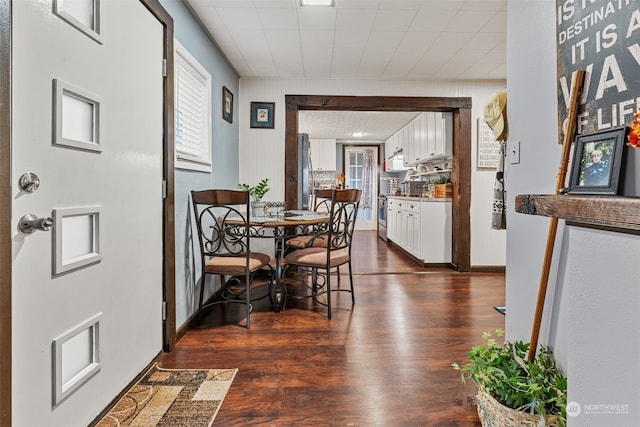 dining area featuring dark hardwood / wood-style flooring