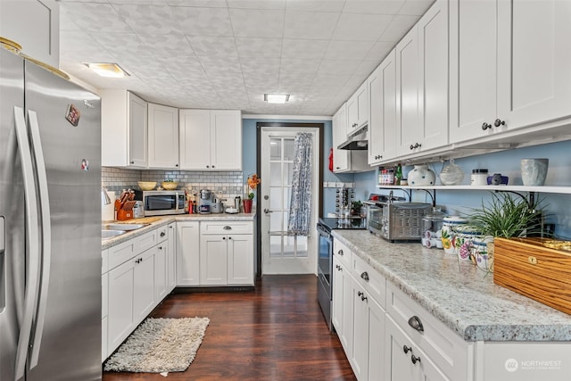 kitchen featuring dark wood-type flooring, sink, light stone counters, white cabinetry, and stainless steel appliances