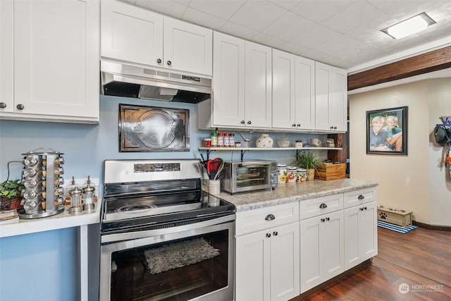 kitchen featuring light stone countertops, white cabinetry, dark hardwood / wood-style flooring, and stainless steel electric range oven