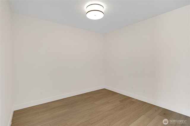 5129 N Bennett St, Ruston, WA 98407 - empty room featuring light wood finished floors and baseboards