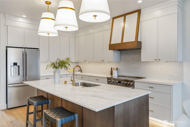 5123 N Bennett St, Ruston, WA 98407 - kitchen with stainless steel fridge with ice dispenser, a sink, premium range hood, stove, and decorative backsplash