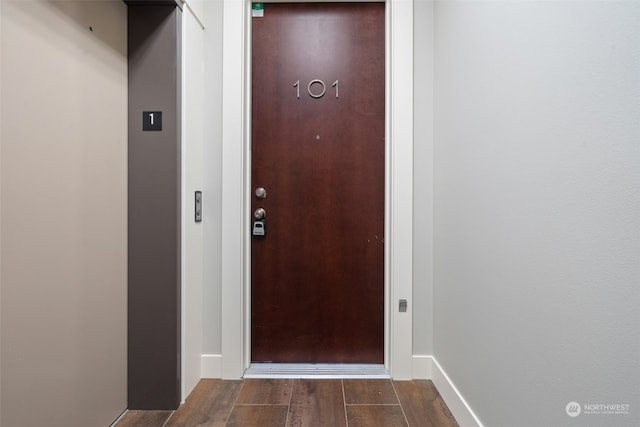 doorway to outside featuring dark hardwood / wood-style floors