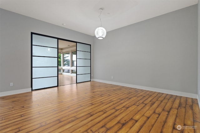 spare room with light wood-type flooring