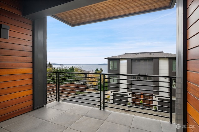 balcony featuring a water view