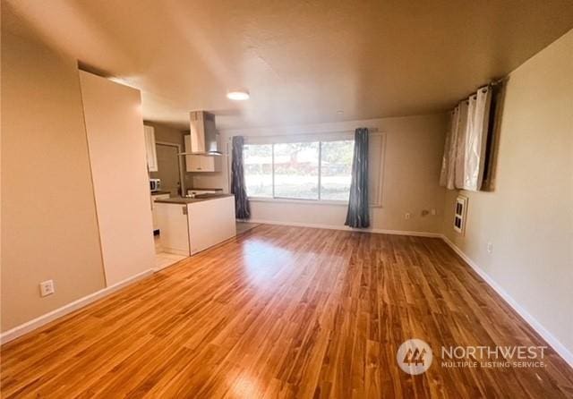 5503 112th St SW, Lakewood, WA 98499 - unfurnished living room with wood finished floors and baseboards