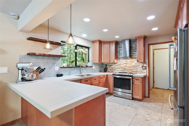 kitchen with backsplash, sink, wall chimney exhaust hood, kitchen peninsula, and stainless steel appliances