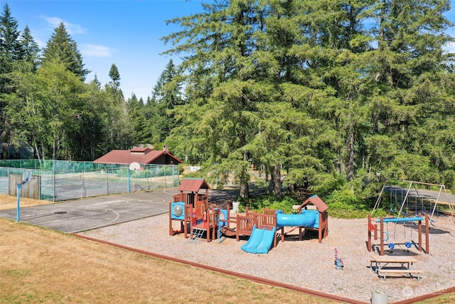 view of jungle gym featuring basketball hoop