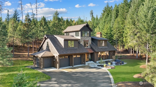 view of front of home featuring a garage and a front lawn