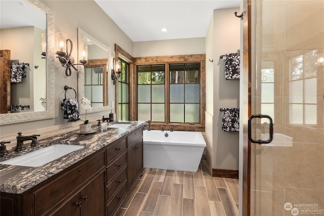 bathroom with vanity and independent shower and bath