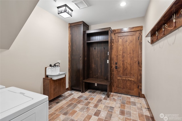 washroom with cabinets and independent washer and dryer