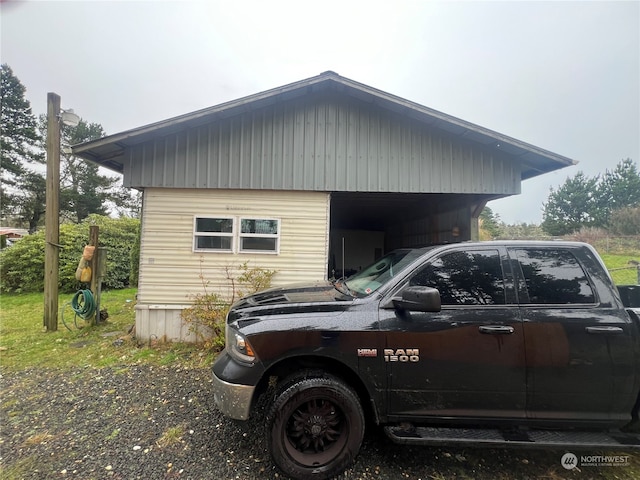 view of home's exterior with a carport