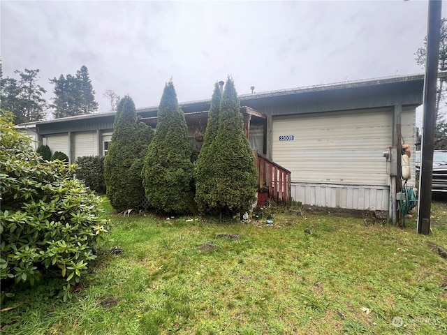 view of property exterior with a lawn