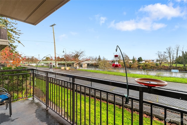 balcony featuring a water view