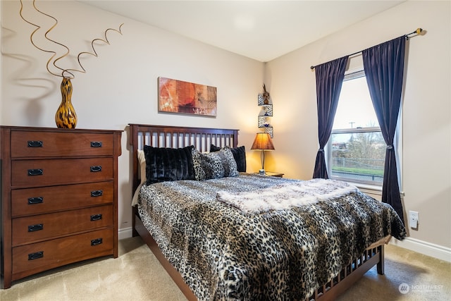 bedroom featuring light colored carpet