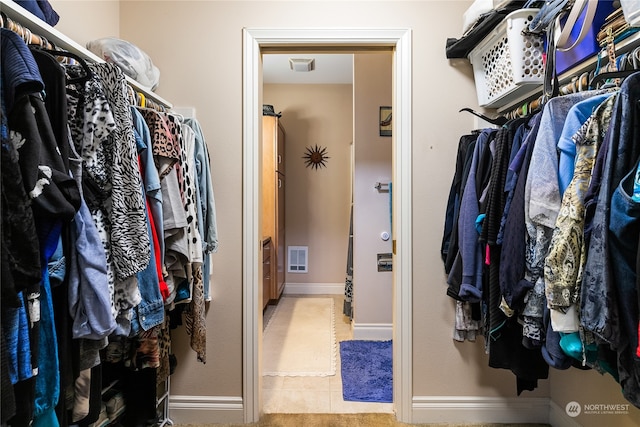 spacious closet with light tile patterned flooring