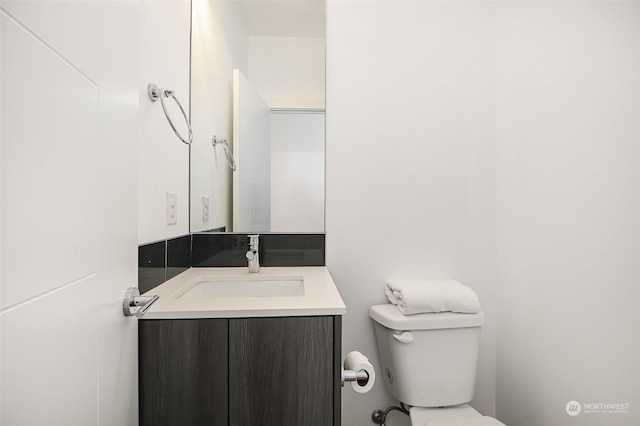 bathroom with vanity and toilet