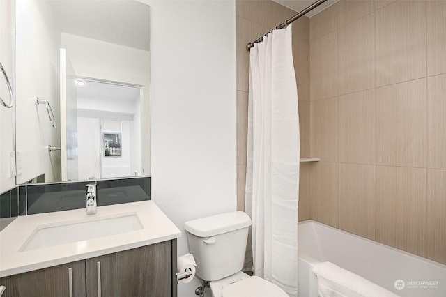 full bathroom featuring vanity, toilet, and shower / tub combo