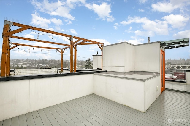 wooden deck featuring a pergola