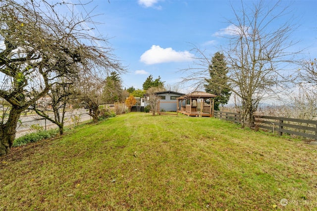 view of yard featuring a wooden deck