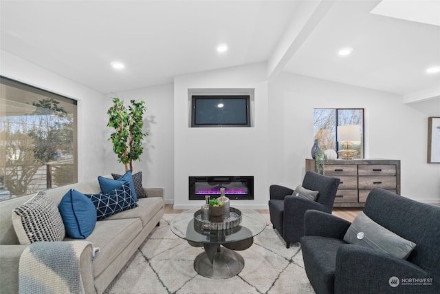 living room with light hardwood / wood-style flooring and lofted ceiling with beams