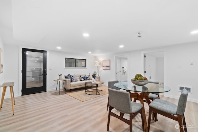 dining space featuring light wood-type flooring