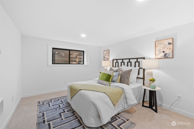 bedroom featuring light colored carpet