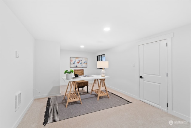 office area featuring light colored carpet