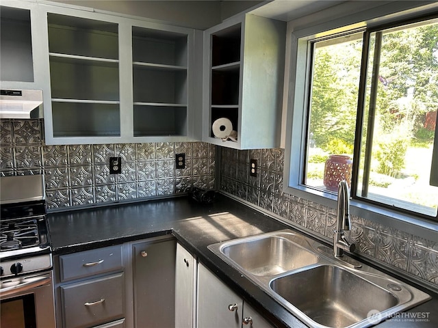450 Spruce St, Friday Harbor, WA 98250 - kitchen with a sink, backsplash, dark countertops, exhaust hood, and gas stove