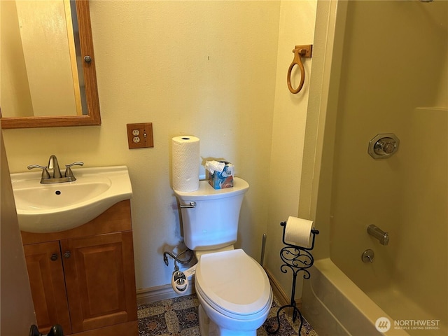 450 Spruce St, Friday Harbor, WA 98250 - full bath featuring baseboards, vanity, toilet, and bathing tub / shower combination