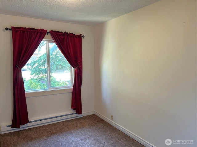 450 Spruce St, Friday Harbor, WA 98250 - unfurnished room featuring a baseboard radiator, carpet flooring, and a textured ceiling