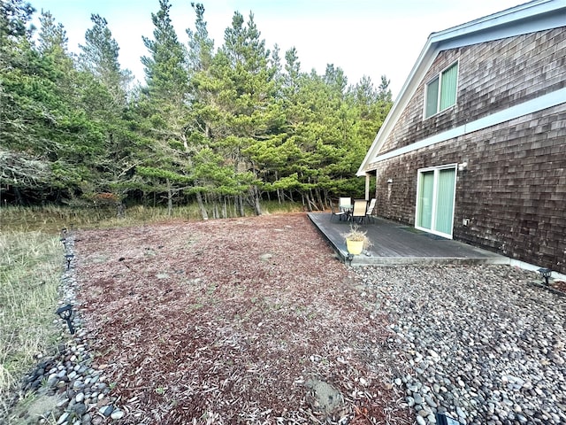 view of yard featuring a wooden deck